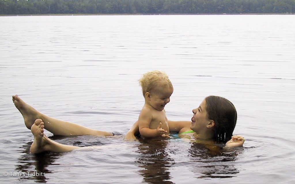 Kids floating in lake