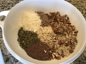 granola ingredients in a large bowl